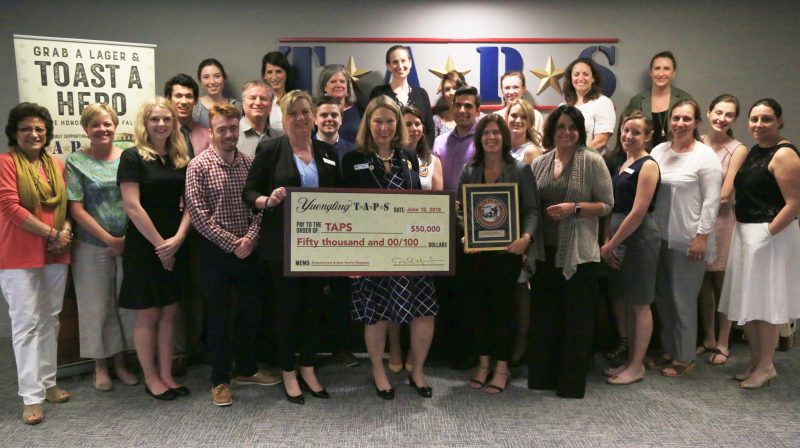 Debbie Yuengling presenting the TAPS organization with a $50,000 check